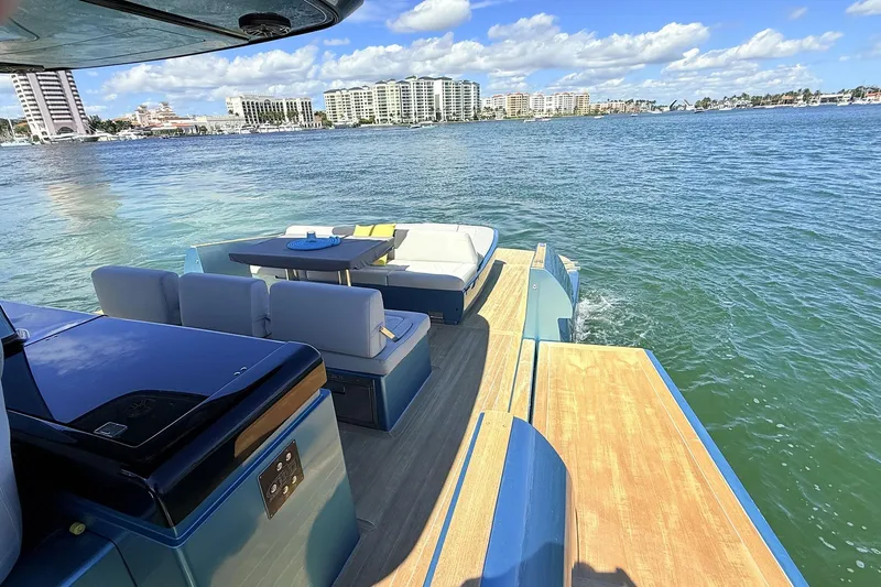  Yacht Photos Pics Luxurious 2022 Solaris Power 44 yacht with elegant seating, cruising on a sunny day.