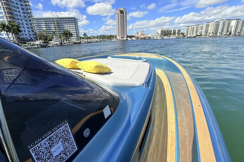  Yacht Photos Pics 2022 Solaris Power 44 yacht on water, city skyline, sunny day, QR code visible.