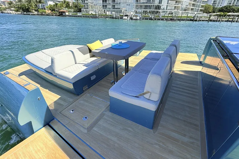  Yacht Photos Pics Luxurious 2022 Solaris Power 44 yacht with elegant seating and scenic waterfront view.