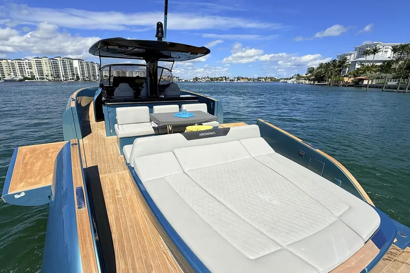  Yacht Photos Pics Luxurious 2022 Solaris Power 44 yacht with spacious deck, cruising on scenic waterfront.