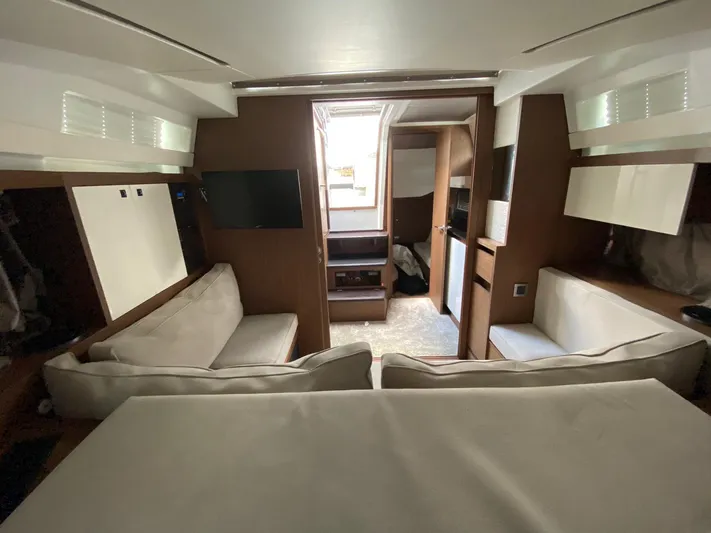  Yacht Photos Pics Interior of 2018 Jeanneau Leader 33 yacht with modern seating and entertainment area.