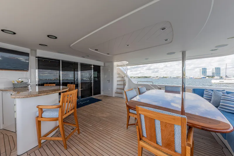 Spirit Yacht Photos Pics Luxury deck of 2010 Westport 112 yacht with dining area and ocean view.