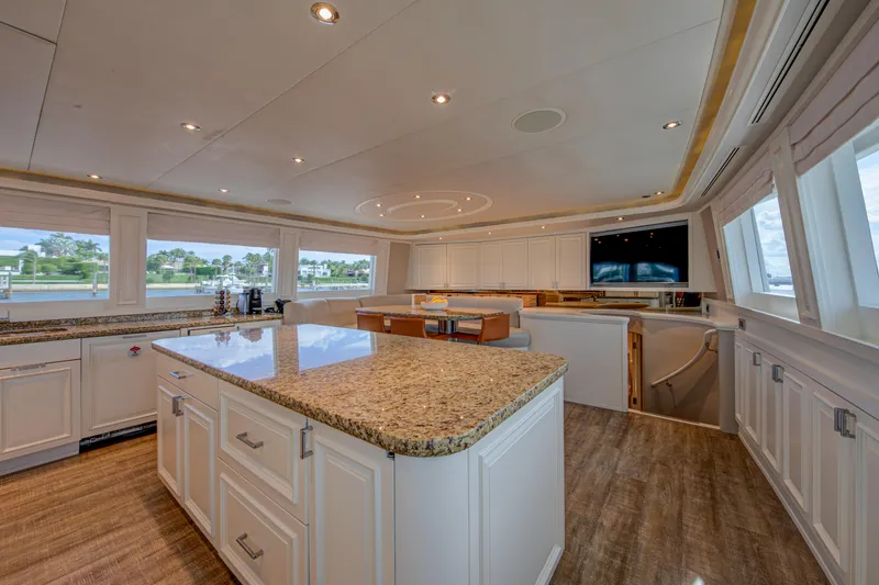 Spirit Yacht Photos Pics Luxurious kitchen interior of 2010 Westport 112 yacht with granite countertops and panoramic windows.