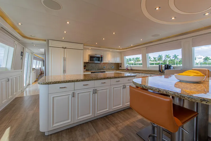 Spirit Yacht Photos Pics Luxurious kitchen interior of 2010 Westport 112 yacht with granite countertops and modern appliances.