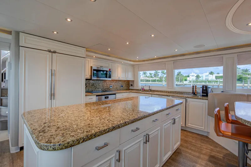 Spirit Yacht Photos Pics Luxurious kitchen interior of 2010 Westport 112 yacht with granite countertops and modern appliances.