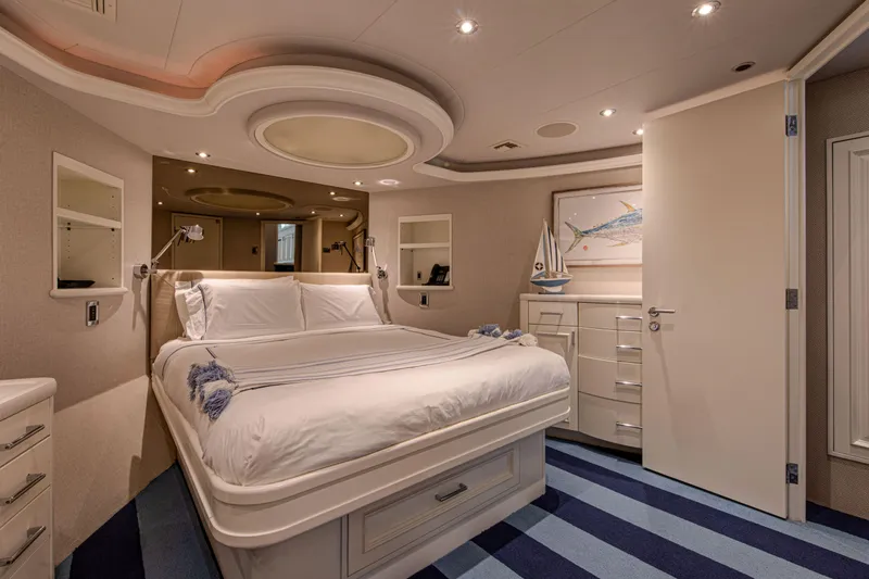 Spirit Yacht Photos Pics Luxurious bedroom interior of 2010 Westport 112 yacht with modern decor and ambient lighting.