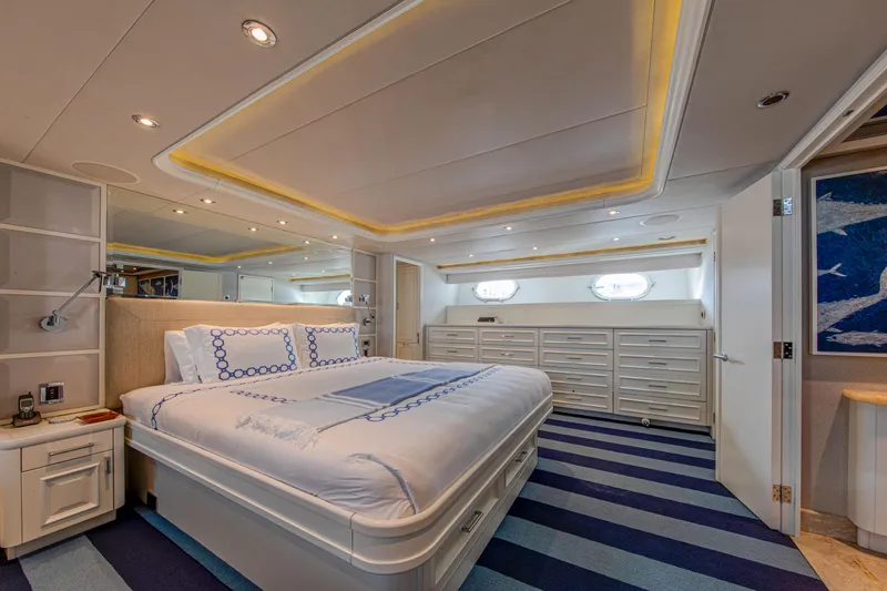 Spirit Yacht Photos Pics Luxurious bedroom on a 2010 Westport 112 yacht with modern decor and ample storage.