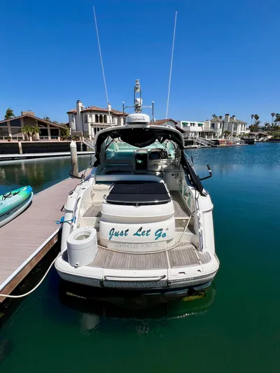  Yacht Photos Pics 1999 Fairline Targa 48 Open yacht docked in a sunny marina.