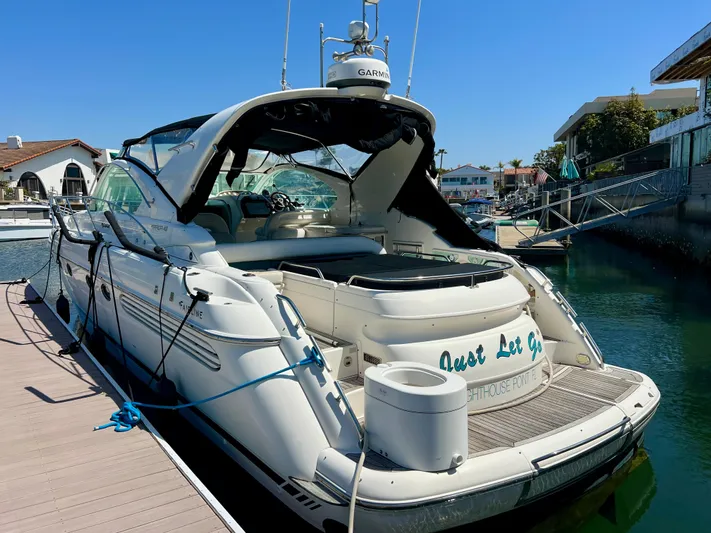  Yacht Photos Pics 1999 Fairline Targa 48 Open yacht docked at marina under clear blue sky.
