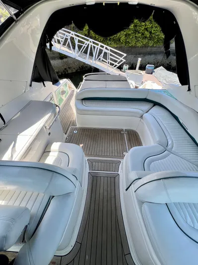  Yacht Photos Pics Interior view of 1999 Fairline Targa 48 Open yacht with white seating and wooden flooring.