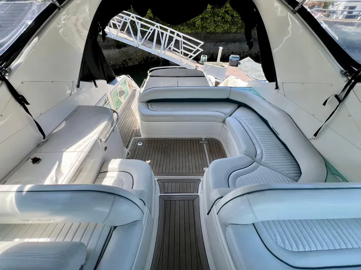  Yacht Photos Pics 1999 Fairline Targa 48 Open yacht interior with white leather seating and teak flooring.