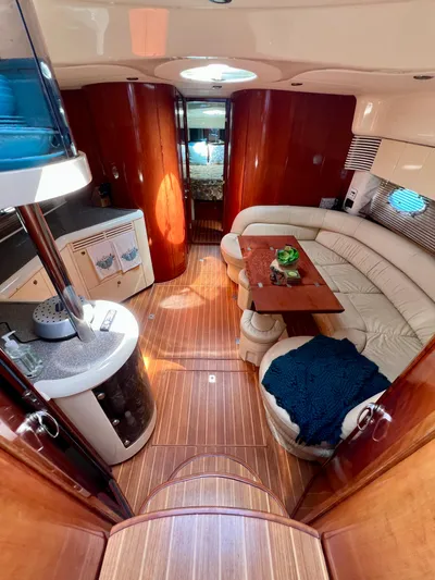  Yacht Photos Pics 1999 Fairline Targa 48 Open yacht interior with elegant wood finish and cozy seating area.