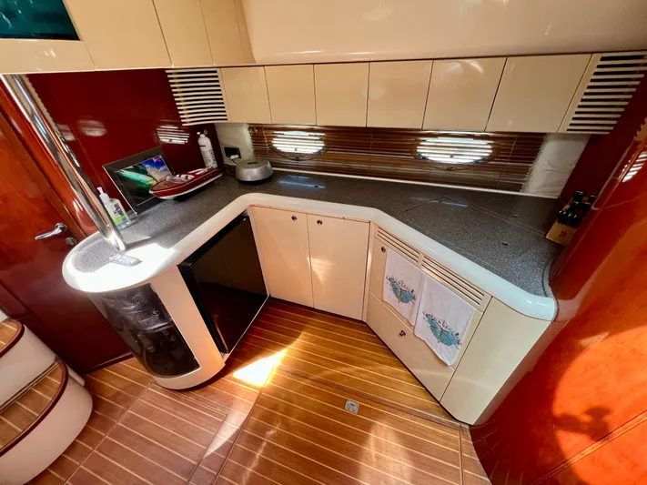  Yacht Photos Pics Luxurious kitchen interior of 1999 Fairline Targa 48 Open yacht with modern amenities.