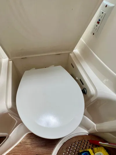  Yacht Photos Pics Toilet in 1999 Fairline Targa 48 Open yacht bathroom, featuring modern design and controls.