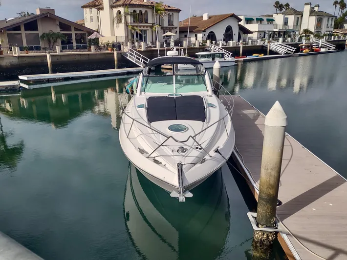  Yacht Photos Pics 1999 Fairline Targa 48 Open yacht docked in a serene marina setting.