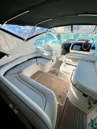  Yacht Photos Pics Interior of 1999 Fairline Targa 48 Open yacht with luxurious seating and wooden flooring.