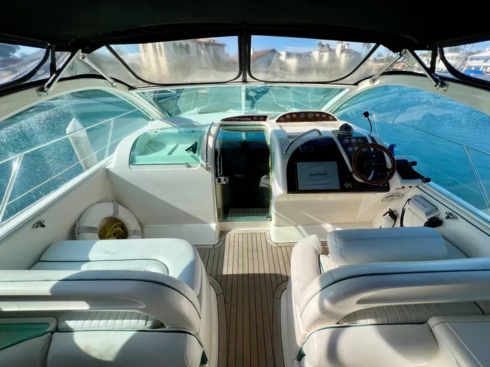  Yacht Photos Pics 1999 Fairline Targa 48 Open yacht cockpit with modern navigation equipment and luxurious seating.