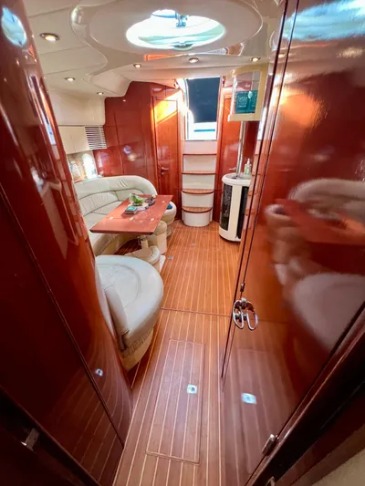  Yacht Photos Pics Luxurious interior of 1999 Fairline Targa 48 Open yacht with elegant wood finish.