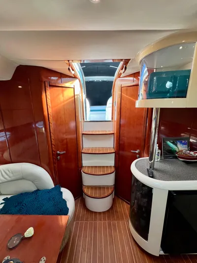  Yacht Photos Pics Interior of 1999 Fairline Targa 48 Open yacht with wooden finishes and modern design.