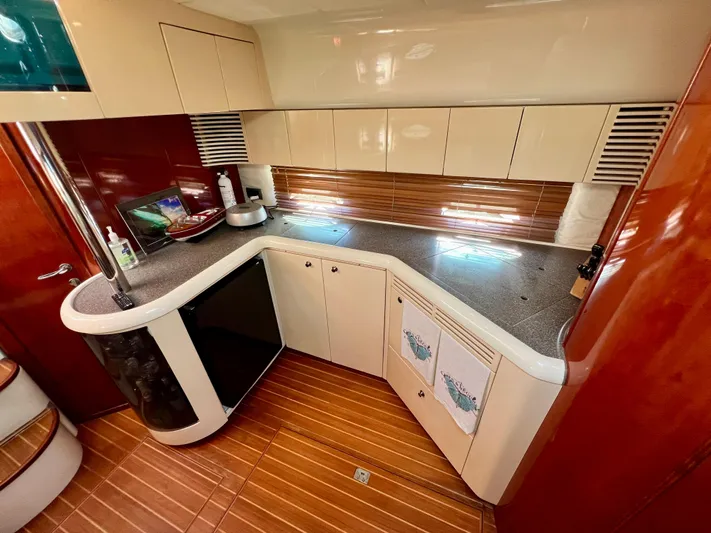  Yacht Photos Pics Luxurious kitchen interior of 1999 Fairline Targa 48 Open yacht with modern cabinetry.
