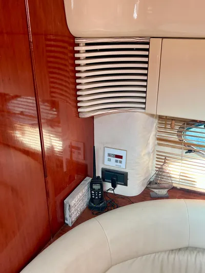  Yacht Photos Pics Interior of 1999 Fairline Targa 48 Open yacht with radio and wooden paneling.