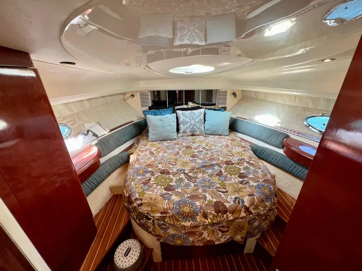  Yacht Photos Pics Luxurious cabin interior of 1999 Fairline Targa 48 Open yacht with floral bedding.