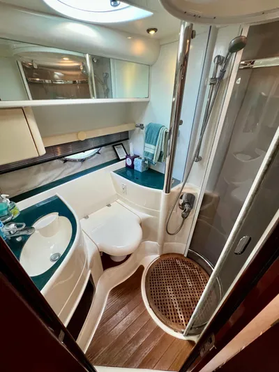  Yacht Photos Pics Luxurious bathroom in 1999 Fairline Targa 48 Open yacht, featuring shower and modern amenities.