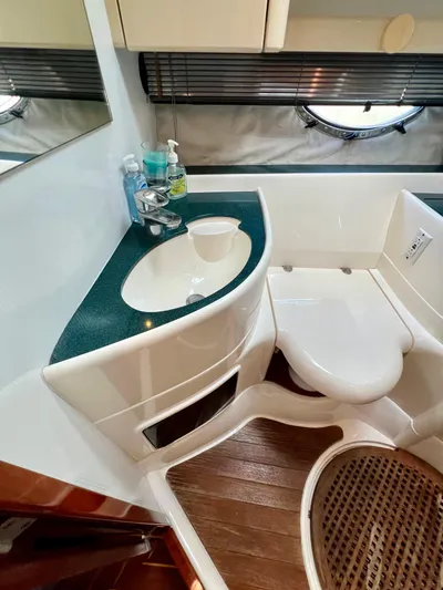  Yacht Photos Pics Bathroom interior of 1999 Fairline Targa 48 Open yacht, featuring sink and toilet.