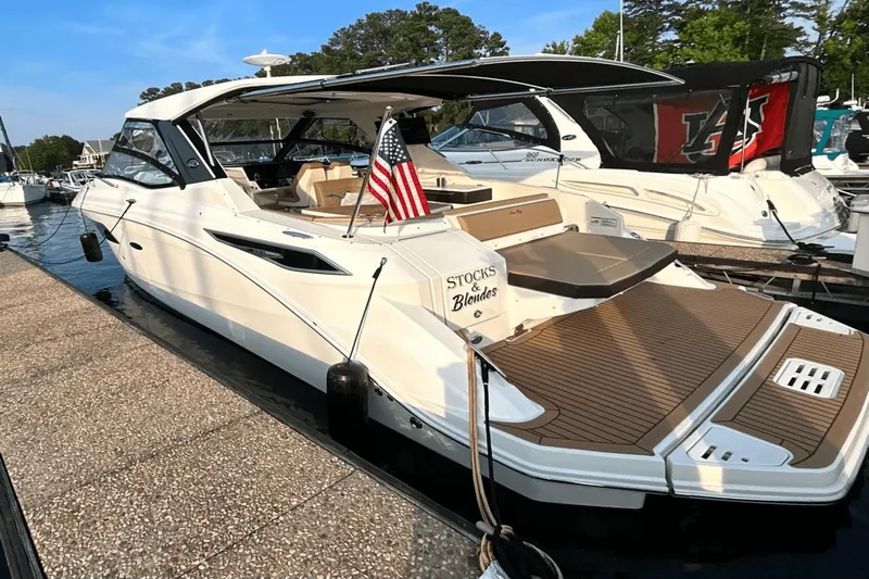  Yacht Photos Pics 2020 Sea Ray 320 boat docked, featuring sleek design and American flag.