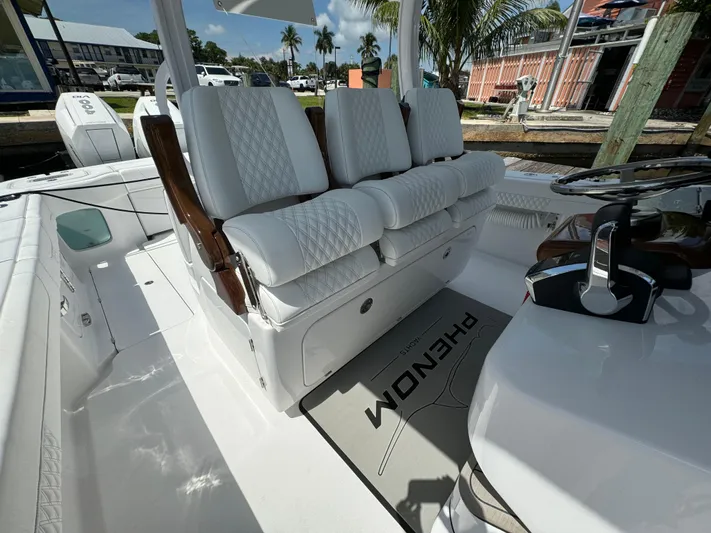  Yacht Photos Pics Luxurious seating on a 2025 Phenom 37 boat, featuring white quilted upholstery.