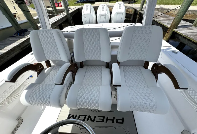  Yacht Photos Pics Luxury seating on 2025 Phenom 37 boat with triple engines at dock.