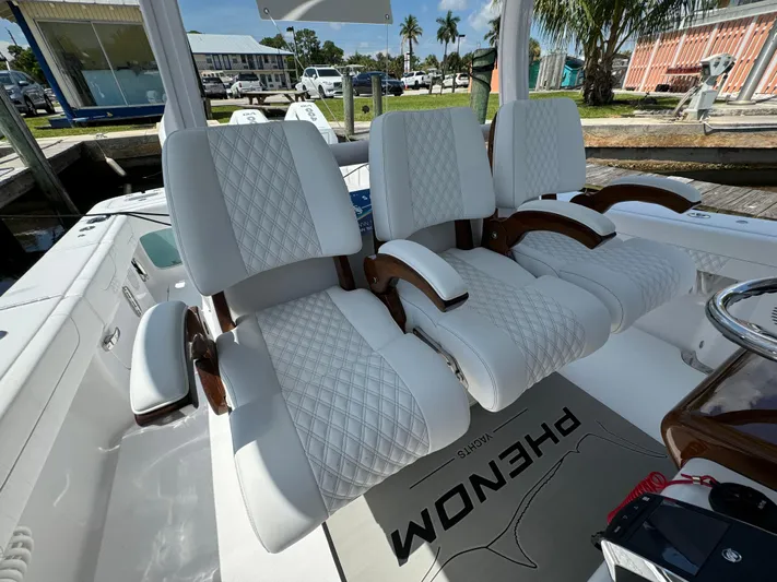  Yacht Photos Pics Luxurious white seating on a 2025 Phenom 37 boat, featuring diamond-pattern upholstery.
