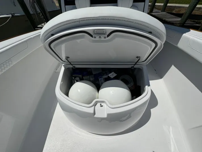  Yacht Photos Pics Open storage compartment on a 2025 Phenom 37 boat, containing white fenders.