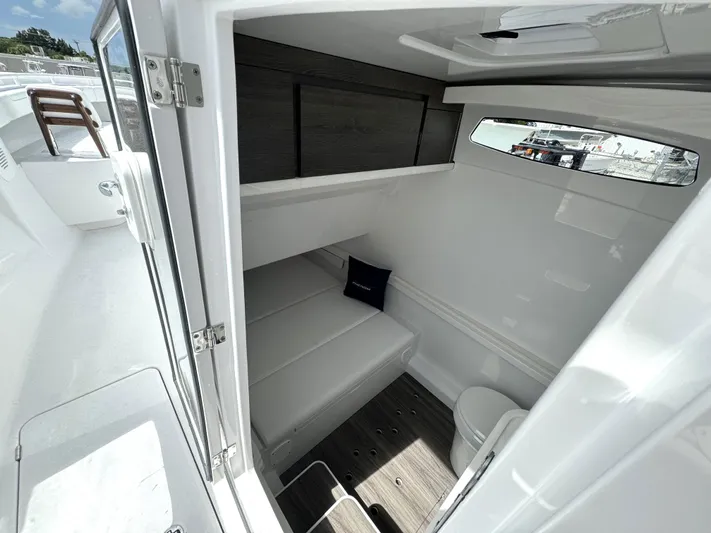  Yacht Photos Pics Interior cabin of 2025 Phenom 37 boat with seating and window.
