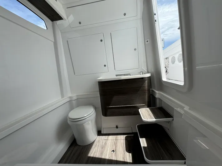  Yacht Photos Pics Modern bathroom interior in 2025 Phenom 37, featuring sleek design and natural lighting.