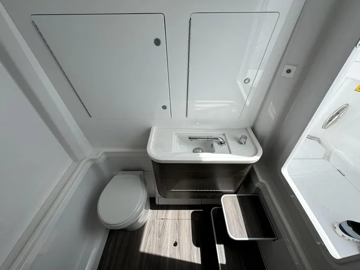  Yacht Photos Pics Modern bathroom interior in 2025 Phenom 37, featuring sleek design and compact fixtures.