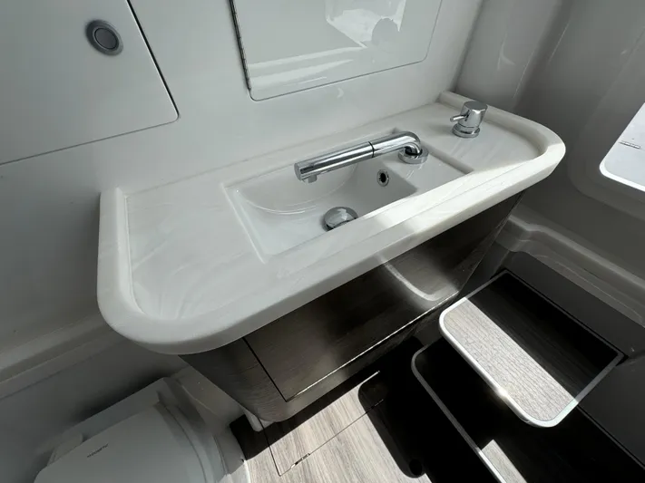  Yacht Photos Pics Modern bathroom sink in 2025 Phenom 37, featuring sleek design and contemporary fixtures.
