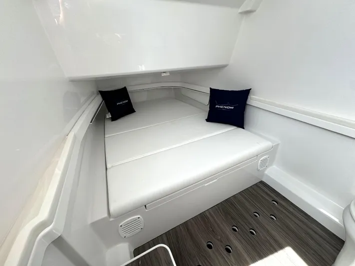  Yacht Photos Pics Luxurious interior of 2025 Phenom 37 boat with cushioned seating and elegant design.