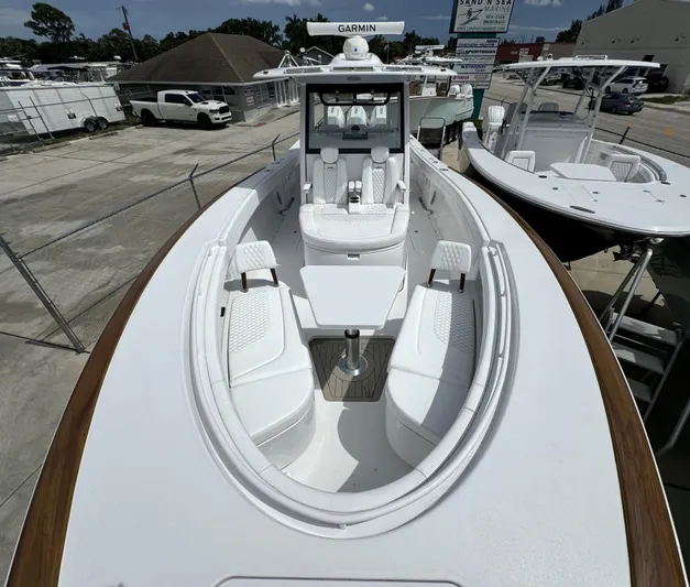  Yacht Photos Pics 2025 Phenom 37 boat with sleek white design and advanced Garmin navigation system.