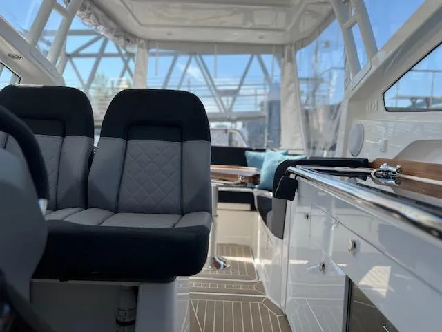 Ala #210 In Stock Yacht Photos Pics Interior of 2023 Nimbus W9 boat with modern seating and sleek design.