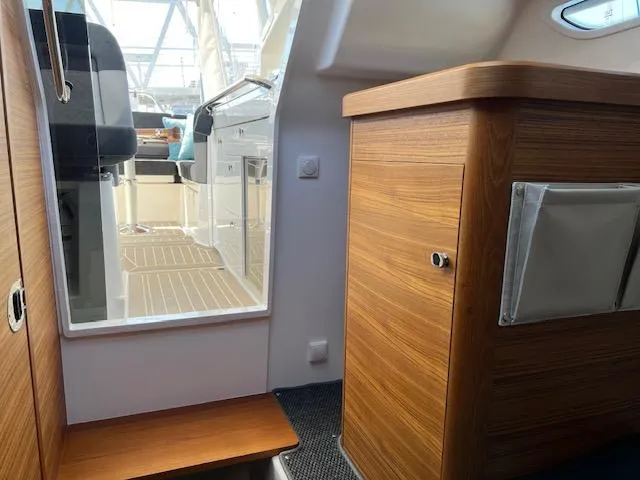 Ala #210 In Stock Yacht Photos Pics Interior of 2023 Nimbus W9 boat with wooden cabinetry and modern design.