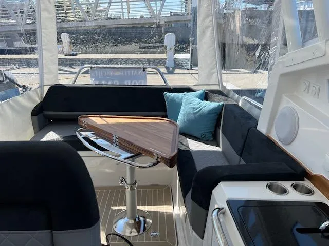 Ala #210 In Stock Yacht Photos Pics Luxurious interior of 2023 Nimbus W9 boat with sleek seating and modern amenities.