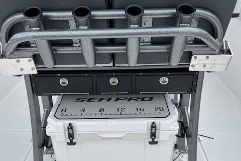 2025 Sea Pro 262 Sport boat with rod holders and storage compartments.