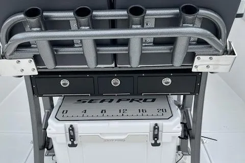 2025 Sea Pro 262 Sport boat with rod holders and storage compartments.