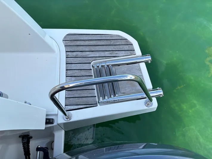 Knot Work'n Yacht Photos Pics Jeanneau 29 NC895 Knot Work'N - 2020 Jeanneau NC895 swim platform with steel ladder