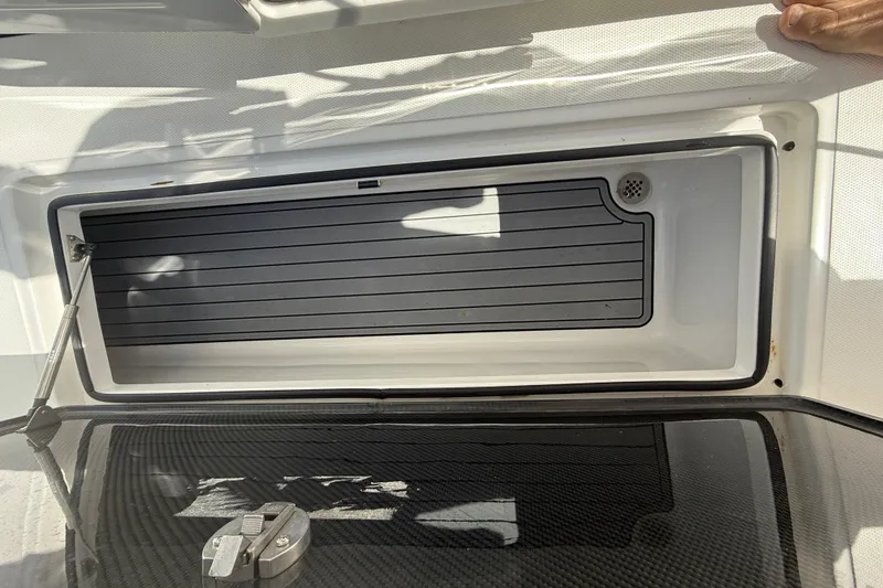  Yacht Photos Pics 2024 SeaHunter 35 Tournament boat storage compartment with open lid and hydraulic support.