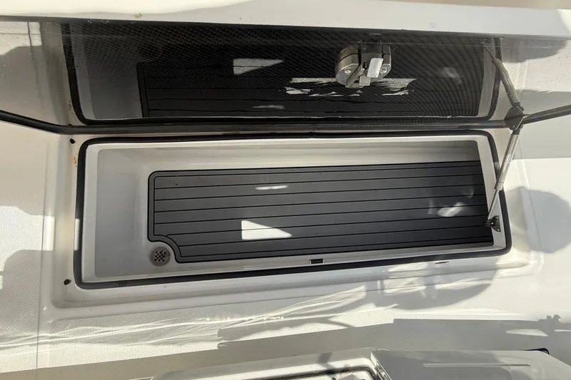 Yacht Photos Pics Open storage compartment on 2024 SeaHunter 35 Tournament boat, featuring a sleek black interior.