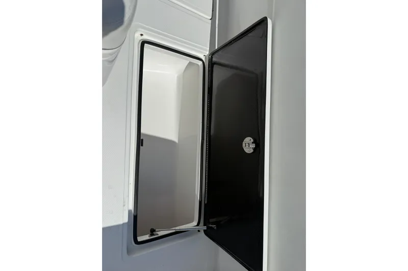  Yacht Photos Pics 2024 SeaHunter 35 Tournament storage compartment with open black door.