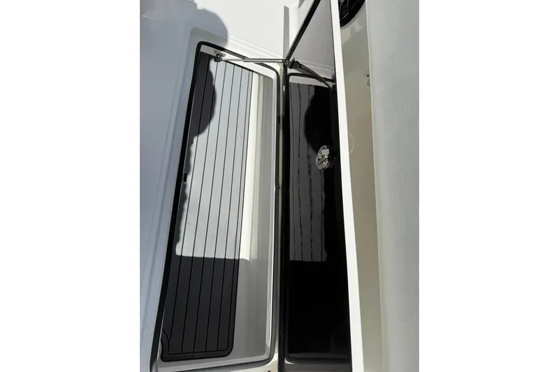  Yacht Photos Pics 2024 SeaHunter 35 Tournament boat storage compartment with sleek black interior.