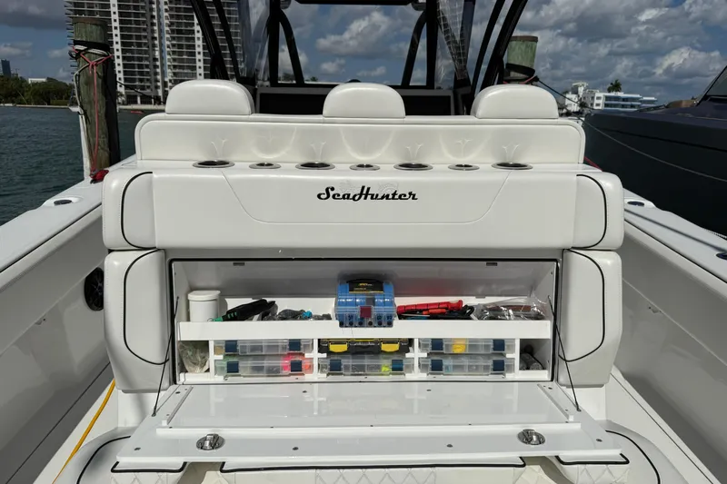  Yacht Photos Pics 2024 SeaHunter 35 Tournament boat with open storage compartment, showcasing organized fishing gear.